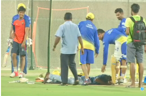 Fan falls at Dhoni\'s feet during net practice in Chennai