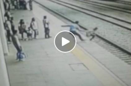 man saves life of an another man who tried to fall in front of train