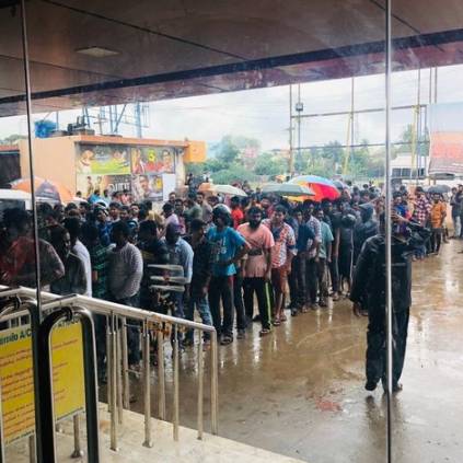 Bigil Fever at its peak where Fans wait to book tickets for Thalapathy Vijays Bigil in rain