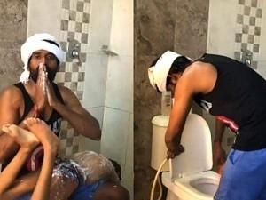 Soori viral video bathing son and asking Modi to drive away coronavirus
